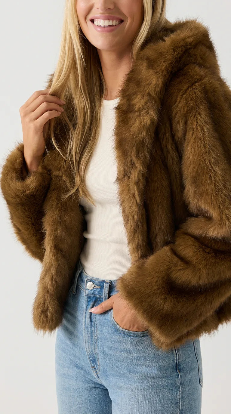 Close-up of a brown faux fur jacket for women with soft long-pile fur, hand in jeans pocket, by ELLA Toronto