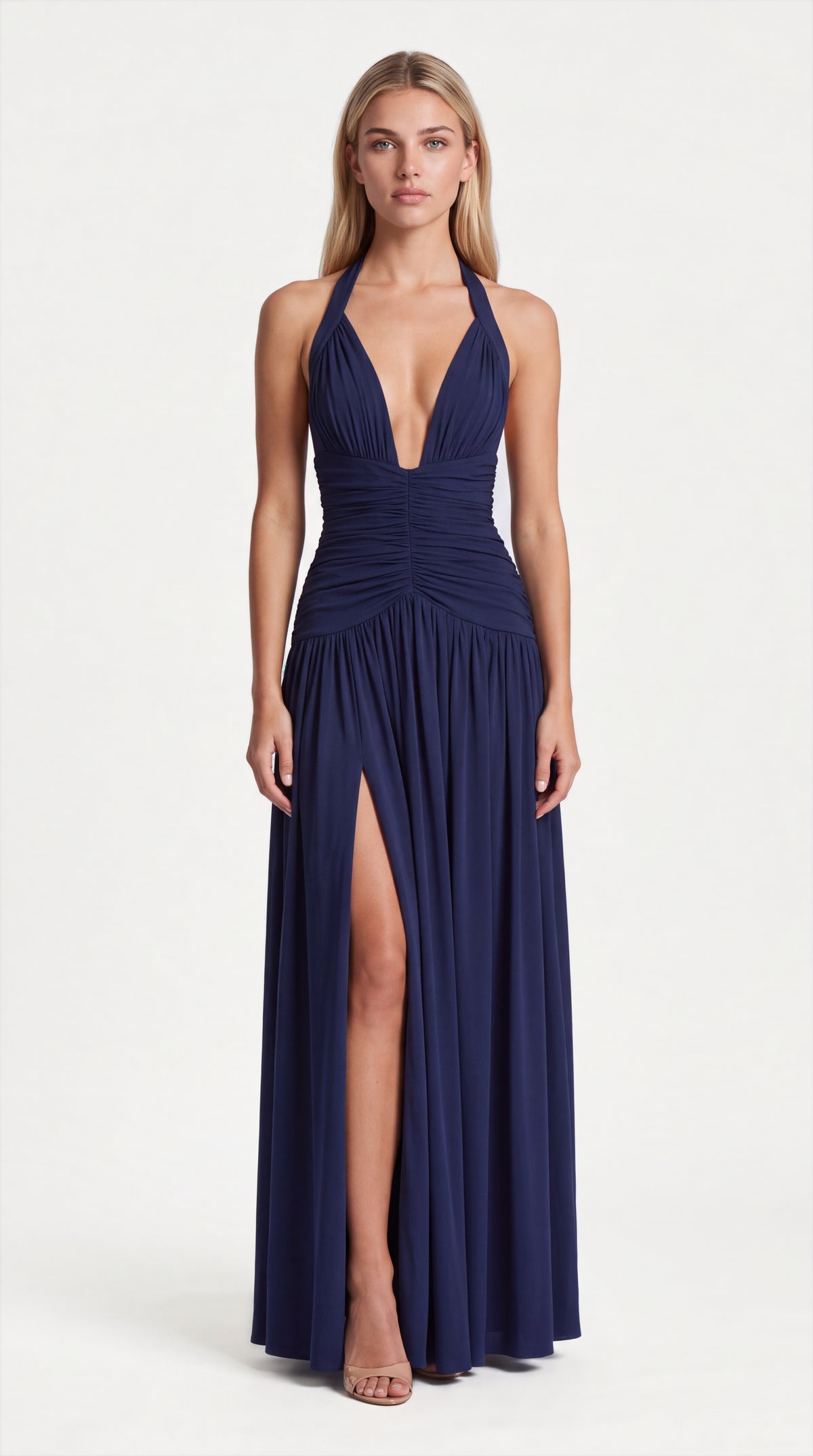 Navy blue halter ruched maxi dress for women, front view of the Colette Halter Ruched Maxi Dress – Navy Blue by ELLA Toronto in a light grey studio
