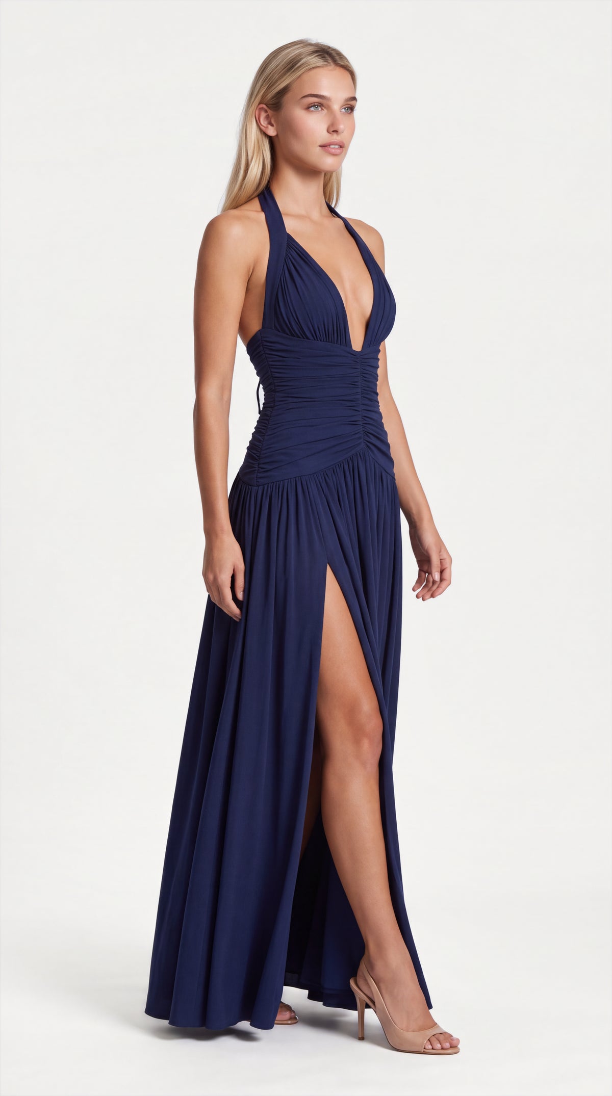 Navy blue halter ruched maxi dress for women, side view of the Colette Halter Ruched Maxi Dress – Navy Blue showing the relaxed fit and length, ELLA Toronto