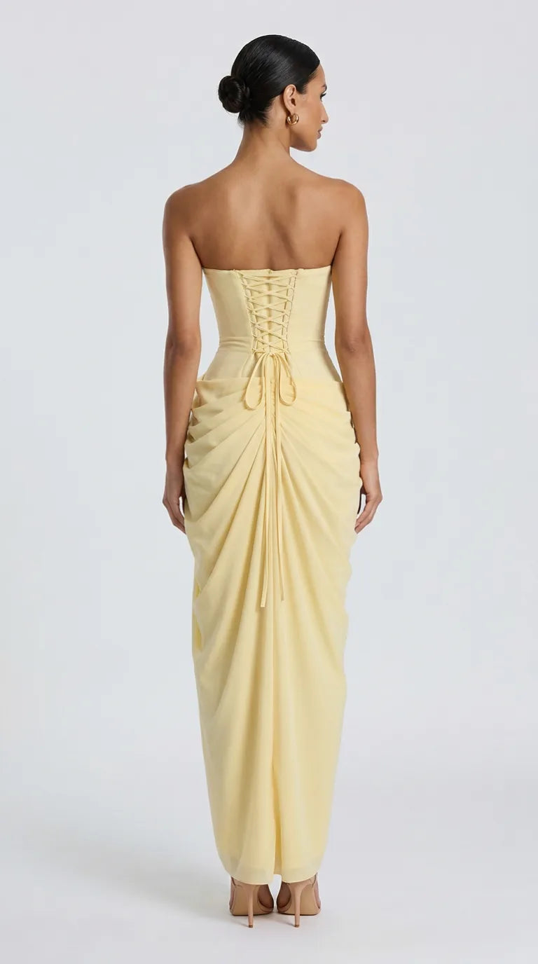 Light yellow strapless draped maxi dress with lace-up corset back for women, back view of the Delphine Draped Maxi Dress – Light Yellow showing the fit and length, ELLA Toronto