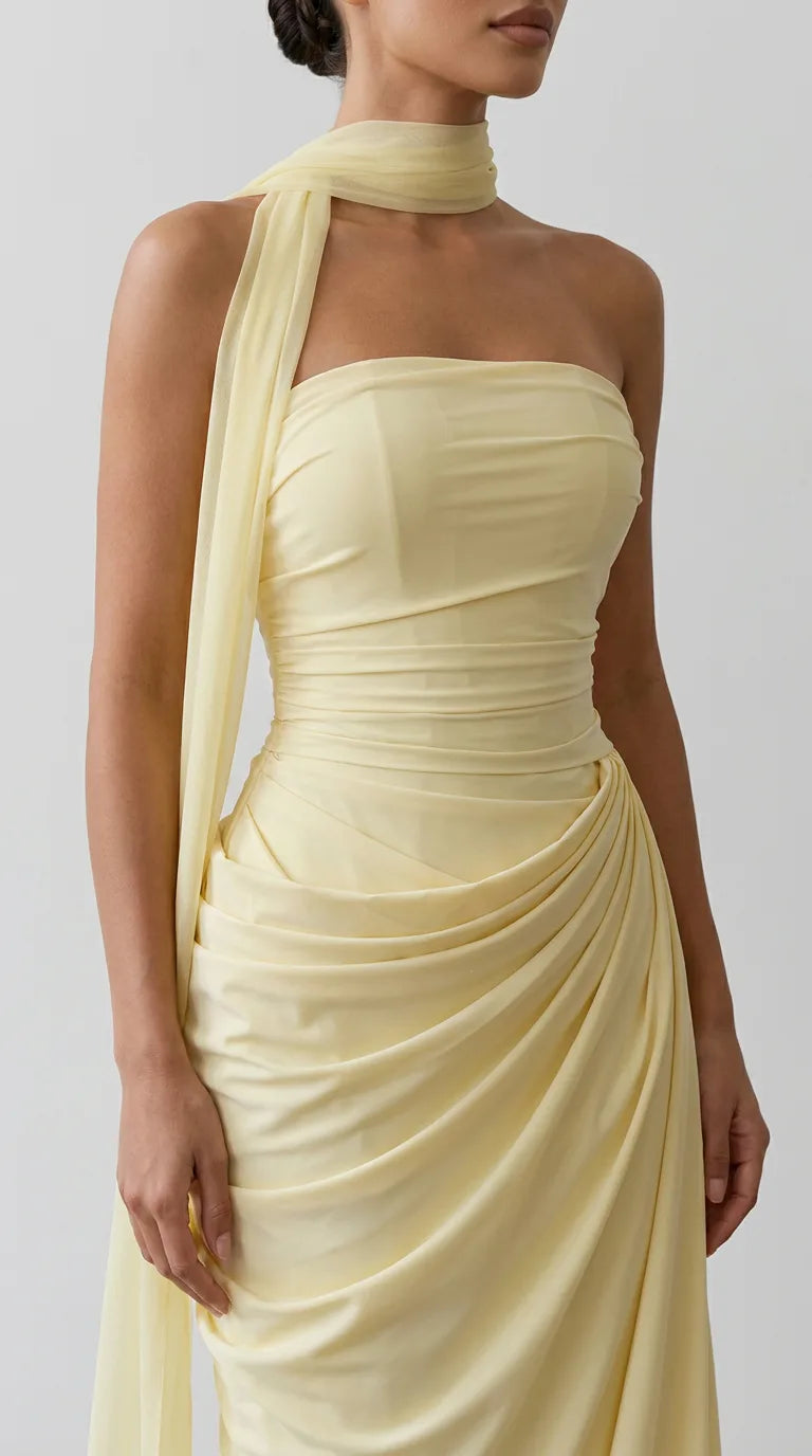 Close-up of the front of the Delphine Draped Maxi Dress – Light Yellow, showing the ruched bandeau neckline and bodice, ELLA Toronto