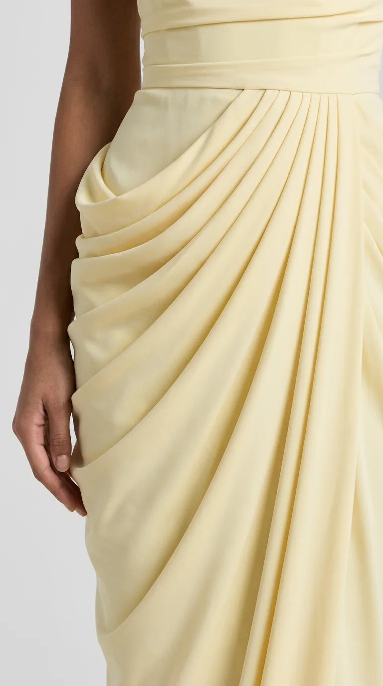 Close-up of the Delphine Draped Maxi Dress – Light Yellow fabric and draping at the waist, ELLA Toronto