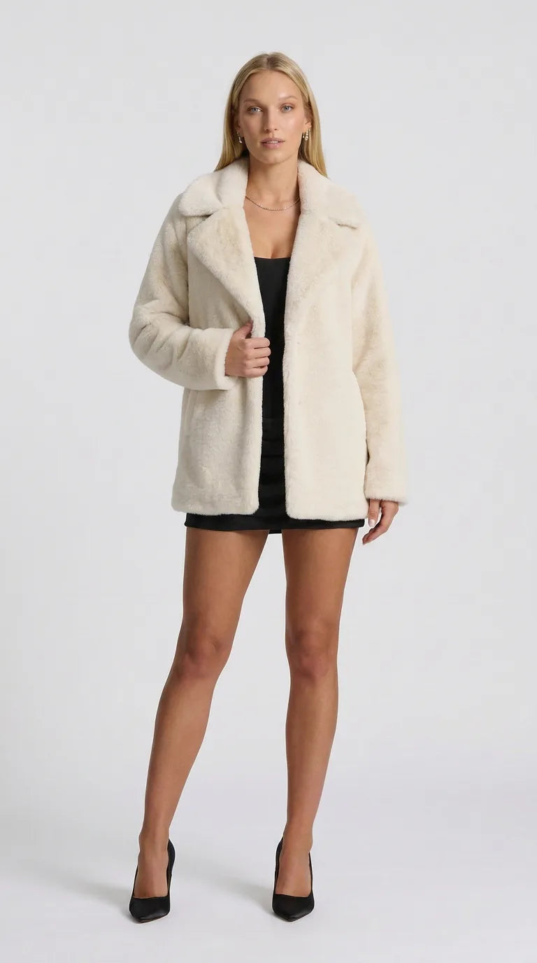 Off-white faux fur lapel jacket for women, front view of the Distillery Faux Fur Jacket by ELLA Toronto in a light grey studio