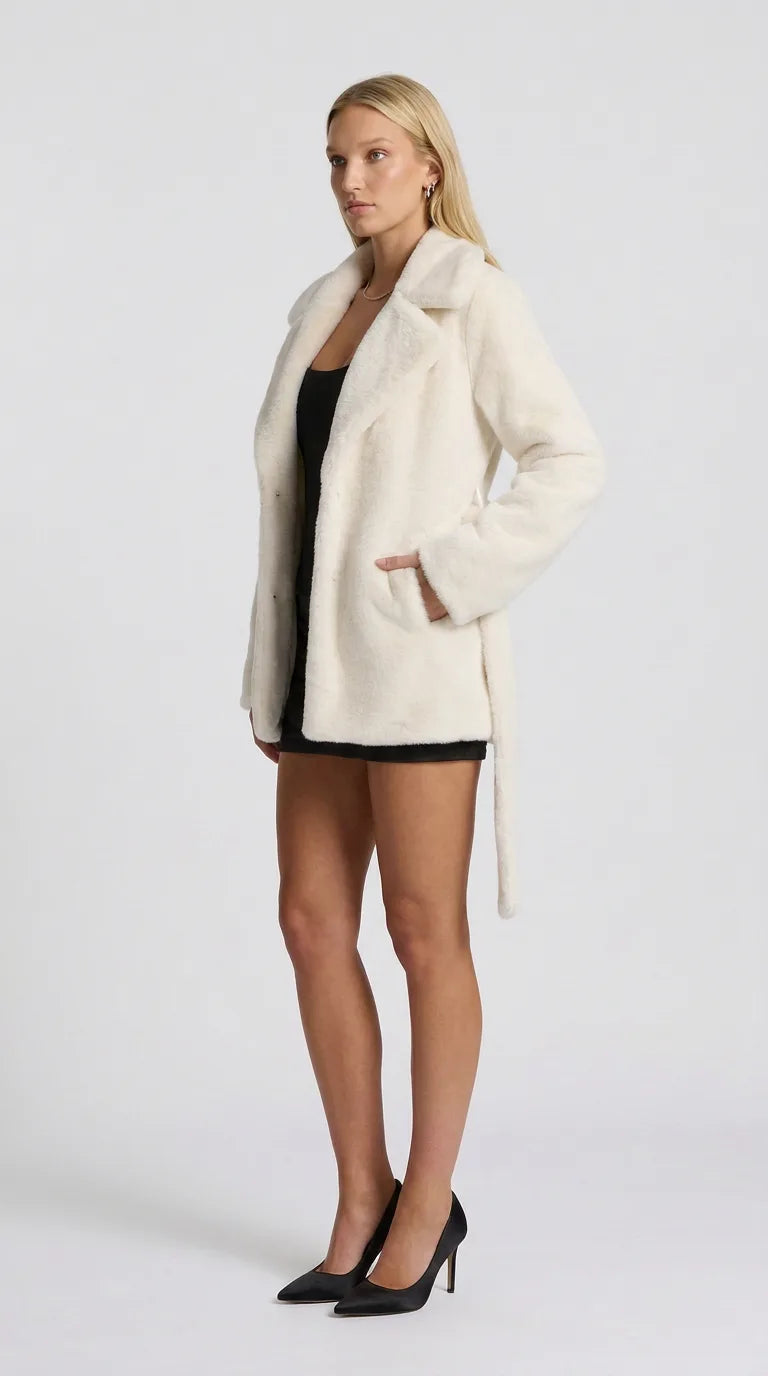 Off-white faux fur lapel jacket for women, side view of the Distillery Faux Fur Jacket showing the relaxed fit and length, ELLA Toronto