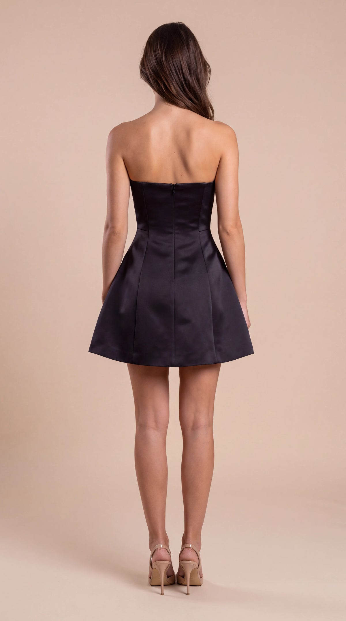 Black strapless satin bell mini dress for women, back view of the Elodie Sculpted Mini Dress – Black showing the fit and length, ELLA Toronto