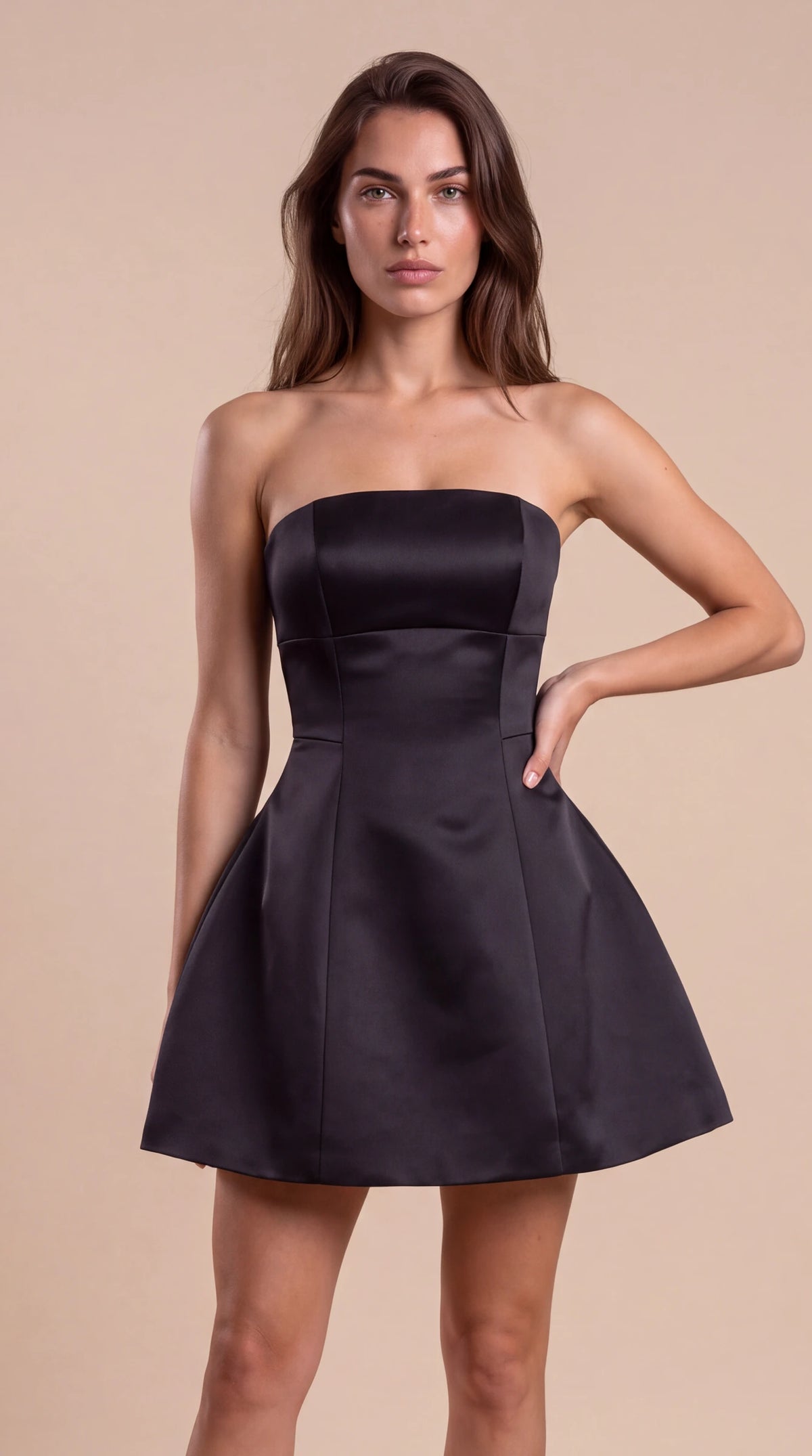 Black strapless satin bell mini dress for women, the Elodie Sculpted Mini Dress – Black by ELLA Toronto, front view from head to knee showing the neckline, bodice and fit