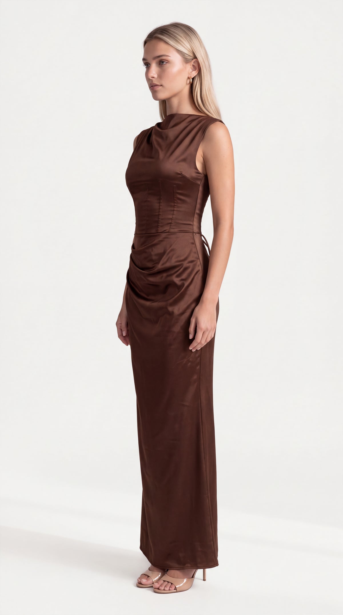 Brown satin corset maxi dress with draped neckline for women, side view of the Genevieve Satin Corset Maxi Dress – Brown showing the relaxed fit and length, ELLA Toronto