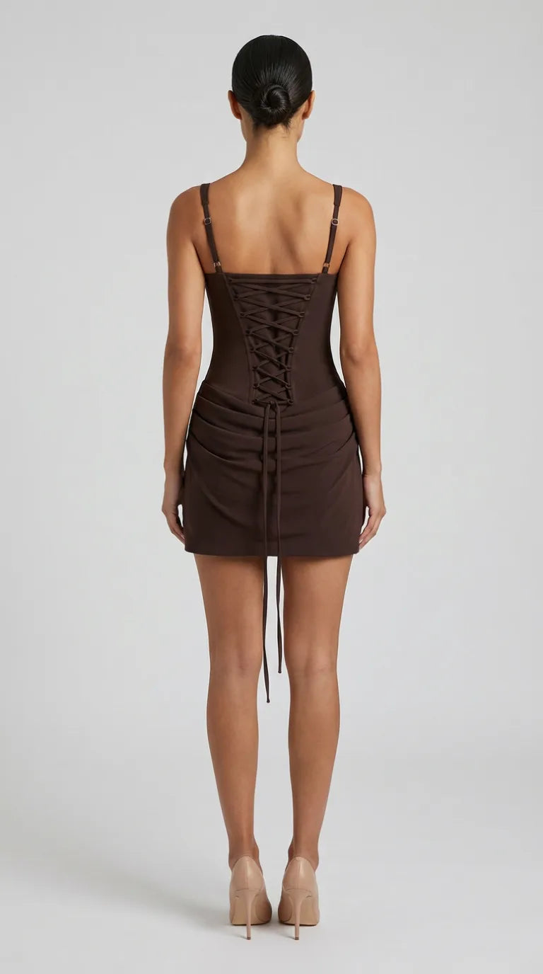Chocolate brown corset mini dress with lace-up back and draped hip skirt for women, back view of the Margaux Corset Mini Dress showing the lace-up back, fit and length, ELLA Toronto