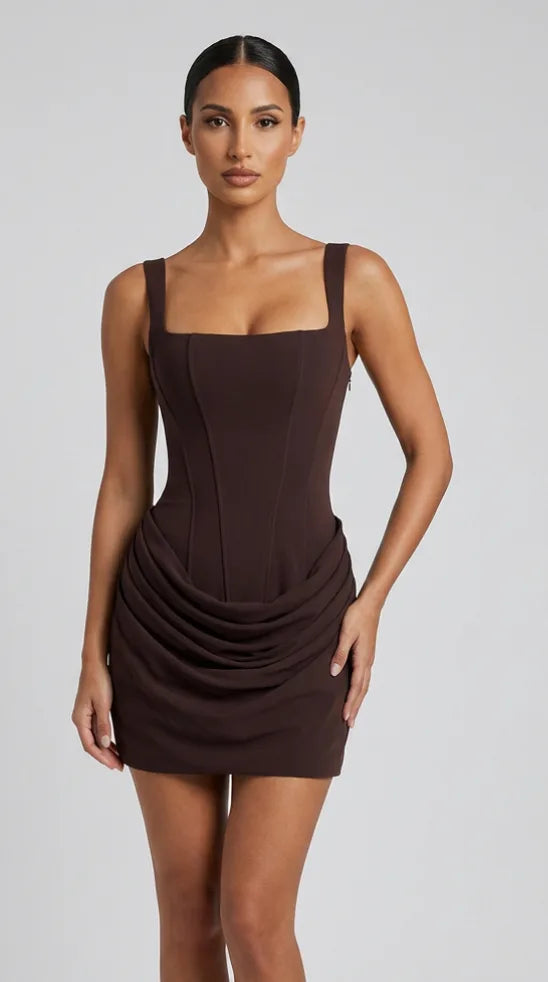 Chocolate brown corset mini dress with lace-up back and draped hip skirt for women, the Margaux Corset Mini Dress – Chocolate Brown by ELLA Toronto, front view from head to knee showing the neckline, bodice and fit