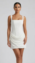 White ivory corset mini dress with lace-up back and draped hip skirt for women, the Margaux Corset Mini Dress – White by ELLA Toronto, front view from head to knee showing the neckline, bodice and fit