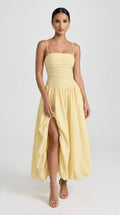 Cream yellow bubble hem midi dress with ruched bodice and front slit for women, front view of the Odette Bubble Midi Dress – Cream Yellow by ELLA Toronto in a light grey studio