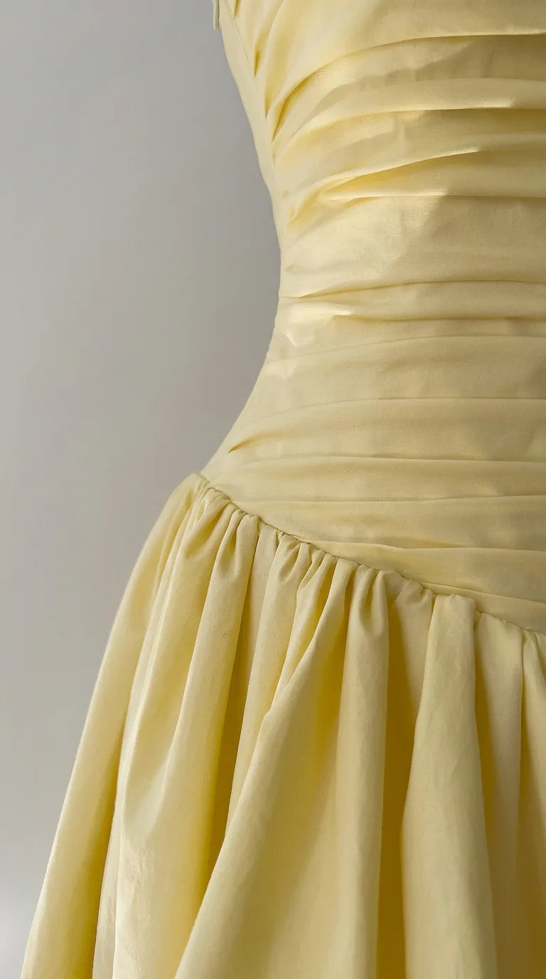 Inside of the Odette Bubble Midi Dress – Cream Yellow held open to show the lining, ELLA Toronto