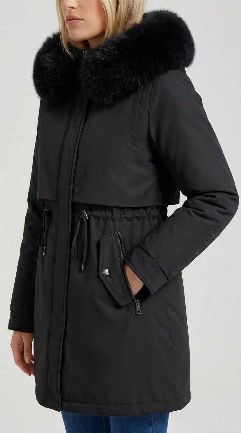 Black women's long parka with black faux fur hood, drawstring waist and zip pocket, ELLA Toronto