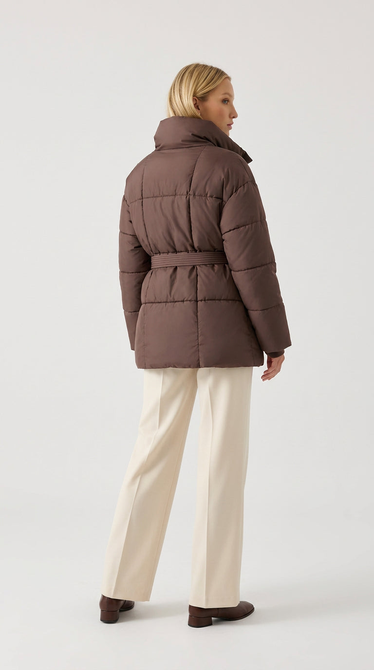 Back view of a brown belted puffer jacket for women, showing the relaxed fit and raglan sleeves
