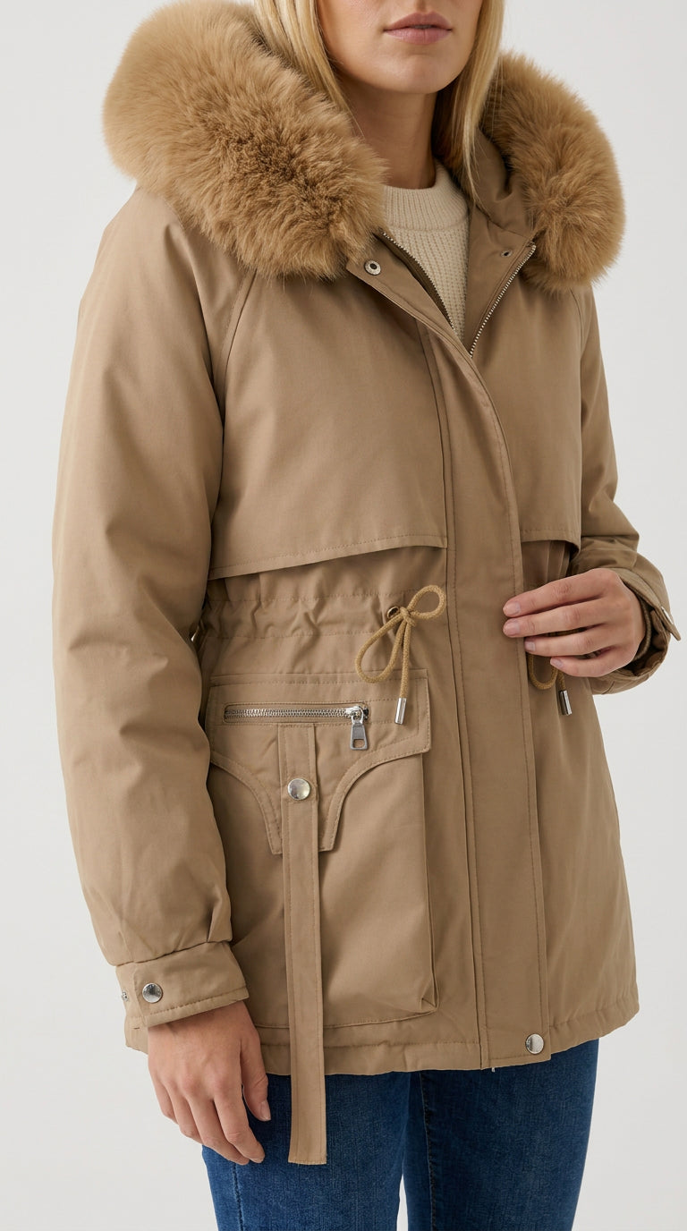 Close-up of the caramel faux fur hood, drawstring bow and snap strap pocket on the khaki Yorkville parka